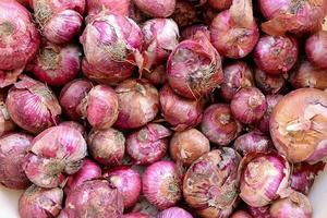 Red onions in plenty on display at local farmer's market, Big fresh red onions background photo