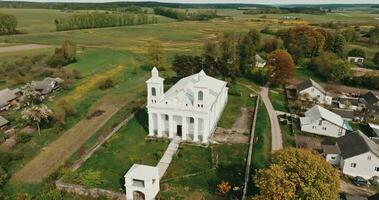 aerial view on old white temple or catholic church in classicism style with cloumns in countryside video