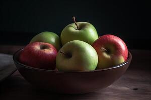 A bowl filled with green and red apples, photo