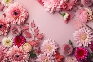 Top view image of pink flowers composition over pastel background, photo