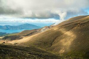 The Volcanic activity during trekking in Tongariro Alpine Crossing in North Island of New Zealand. photo