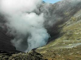 Volcano crater spewing smoke activity at Mount Bromo Tengger Semeru National park photo