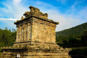 Gedong Songo Temple in the morning with a bright blue sky photo