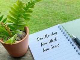 Inspirational and Motivational Concept - New monday new week new goals text background. Stock photo. photo