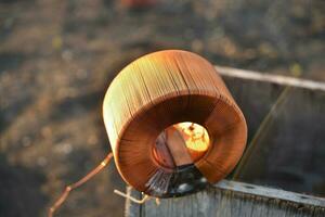 Copper coil. Copper wire wound on a coil. Copper scrap. photo