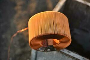 Copper coil. Copper wire wound on a coil. Copper scrap. photo