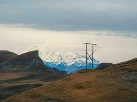 Beautiful high-altitude plateau with a telegraph pole on the bac photo