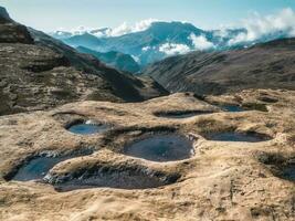 Mountain trekking. View of many small mountain lakes that serve as a lazy herd of cows. photo