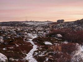 A narrow path to an abandoned weather station on a hill. photo