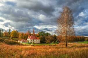 Panoramic view of the beautiful natural landscape. Old castle, blue sky and white fluffy clouds at the sunny summer day. Gatchina. Russia. photo