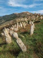 Nameless stone tombstones on the mountainside. photo