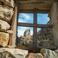 Caucasian Tower. The old stone tower is visible through the window opening. photo