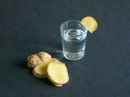 Antiviral tincture of alcohol with ginger root, strengthening of immunity concept photo