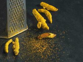 Turmeric root grated. Ingredients of ayurvedic treatment. A remedy for viruses and many diseases photo