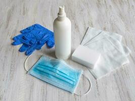 Personal medical protective equipment, mask, sterile gloves, and disinfectants for virus protection photo