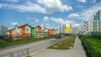 Residential neighborhood on the outskirts of Barnaul. Modern beautiful new buildings. Colored wall. photo