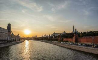 Beautiful evening view of the Moscow river and the architectural complex of the Moscow Kremlin. photo