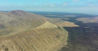 Drone video over the volvano crater of Caldera Blanca on Lanzarote