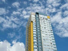 Modern beautiful new buildings. Colored wall on the background of blue sky. photo