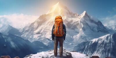 The closeup view of a man with backpack who stand in front of high mountain with . photo