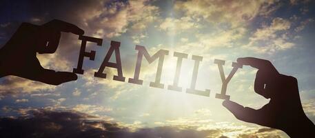 Family - Human Hands Holding Black Silhouette Word photo