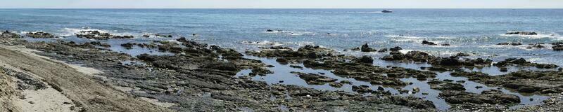 Rocks on Sea Shore in Cala de Mijas, Spain - Panorama photo