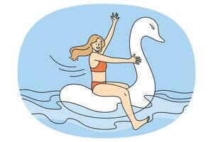 Happy girl in swimsuit float on rubber swan vector