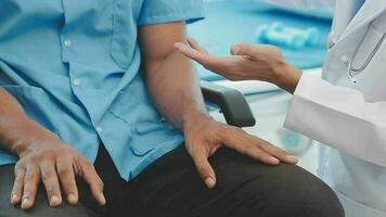 Physiotherapist working with patient in clinic, closeup video