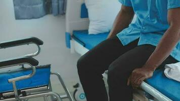 young asian physical therapist working with senior woman on walking with a walker video