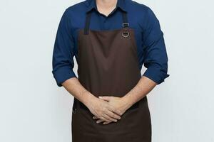 Asian Man wearing Apron in casual stylish clothing, standing tall hospitality pose with both hands in the apron pocket, no face isolated white background photo
