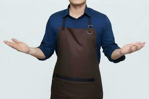 Asian Man wearing Apron in casual stylish clothing, standing tall pose with open arms, can be welcoming or wondering gesture, no face isolated white background photo