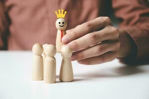 Man holding wooden pawn choosing as leader. photo