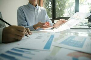 Businessmen working together at desk. photo