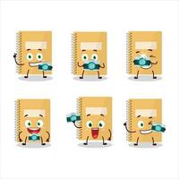 Photographer profession emoticon with brown spiral notebooks cartoon character vector