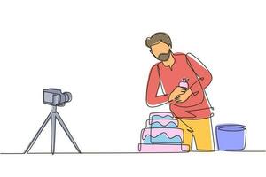 Single one line drawing food blogger creating content. Arab man shooting cooking video using camera on tripod. Chef baking, decorating cake at kitchen. Continuous line draw design vector illustrating