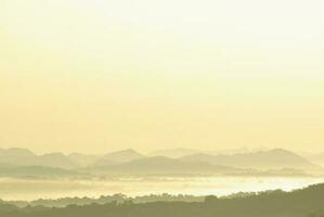 Morning mist and mountain view in the countryside photo