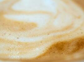 Texture surface of soft and delicate milk froth in a cup of coffee photo