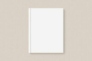 Realistic book blank cover mockup flatlay. Simple blank textbook mock up on clean background top view. White empty book cover to place your design, flat lay concept photo