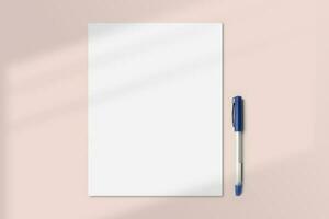 Realistic US letter paper flatlay mockup with a pen. Portrait US letter size mockup top view. Simple, clean, modern, minimal poster mock up flat lay concept photo