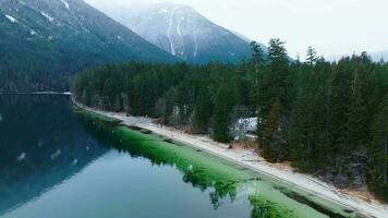 Flight along the coast of Chilliwack Lake and mountains in winter video
