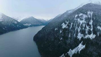 Aerial landscape view of Chilliwack Lake and mountains in winter. video