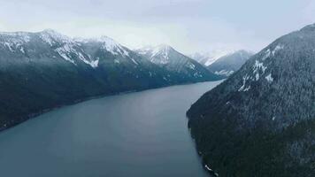 Aerial landscape view of Chilliwack Lake and mountains in winter. video