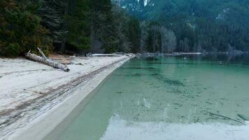 Flight along the coast of Chilliwack Lake in winter video