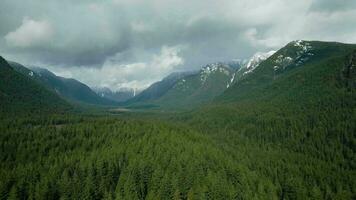 Aerial view of Canadian mountain landscape in cloudy day. Taken near Vancouver video