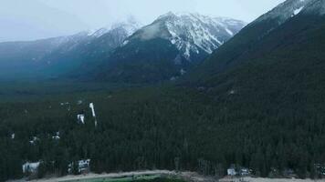 Aerial landscape view of Chilliwack Lake and mountains in winter. video