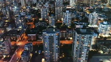 Aerial view of the illuminated skyscrapers at night. Vancouver, Canada. video