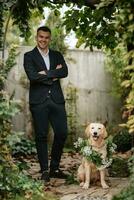 portrait of a young guy groom in a dark wool suit photo