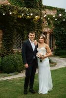 portrait of a young couple of bride and groom on their wedding day photo