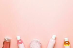 Flat lay spa jars. Mockup jars. Flatlay beauty on pink background photo