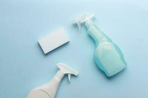 Flat lay cleaning sprays and sponge. Bring cleanliness. Cleaning products photo